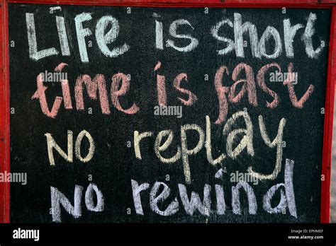 Blackboard Sign With Message Life Is Short Time Is Fast No Replay