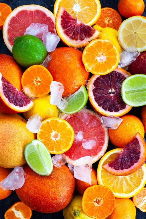 Close Up Of Fresh Juicy Citrus Fruits Oranges Mandarins Lemons And