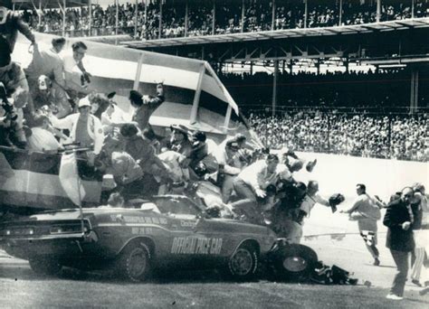 The pace car crashes into a photographer stand at the start of the 1971 ...