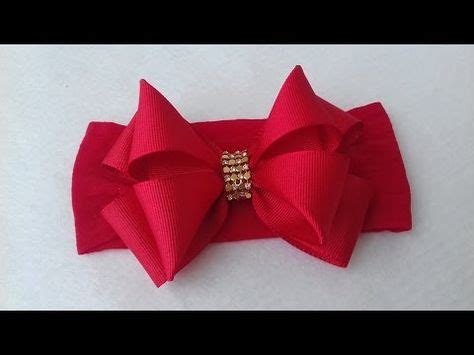 A Red Bow With Gold Beads On It