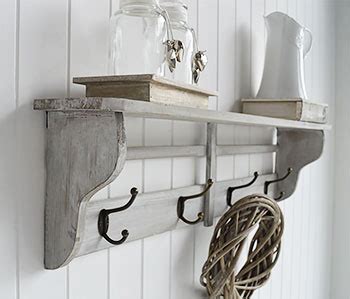 Parisian grey wall shelf with hooks. Four double hooks for coats. Simple hall furniture