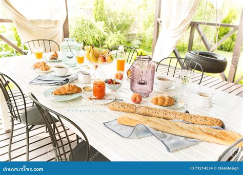 Summer Outdoor Continental Breakfast On The Garden Terrace Stock Photo