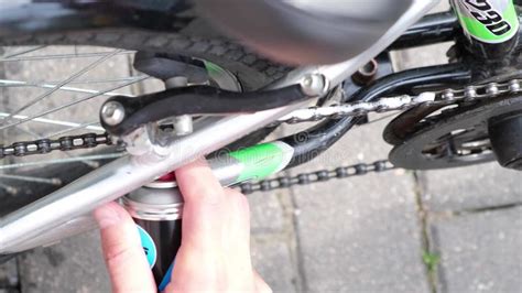 Bike Maintenance Cleaning And Oiling A Bicycle Chain And Gear With Oil