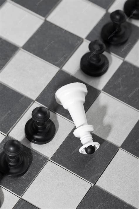 Premium Photo | Monochrome chess pieces with game board