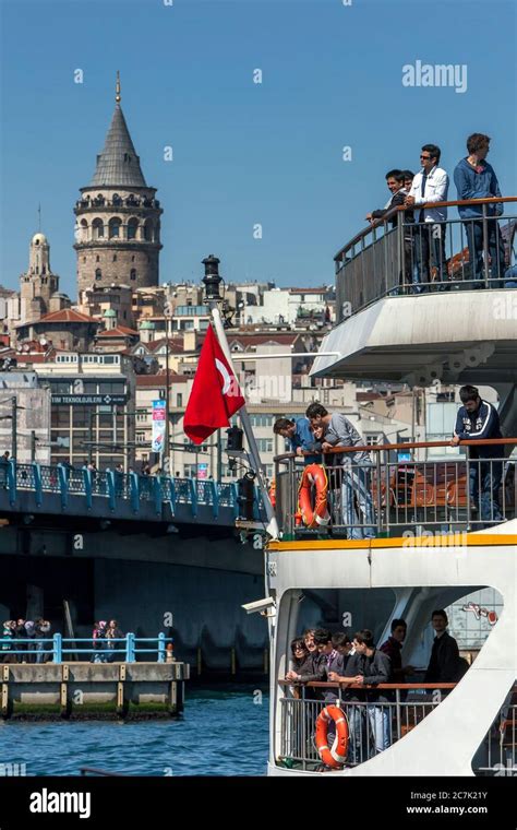 Passengers Aboard A Ferry Leave Port At Golden Horn In The Eminonu