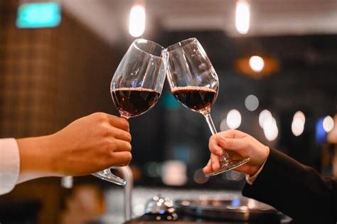 Premium Photo Close Up Of Hand Holding Glass Of Wine