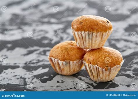 Tasty Muffins Arranged In Pattern On Light Textured Background Close