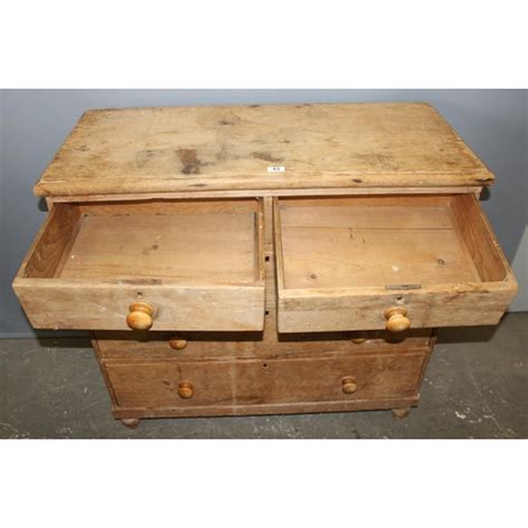 An Antique Pine Over Chest Of Drawers With Bun Feet And Handles