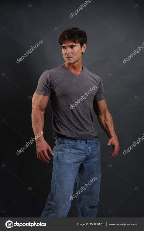 The buff guy is looking very strong — Stock Photo © romancephotos ...