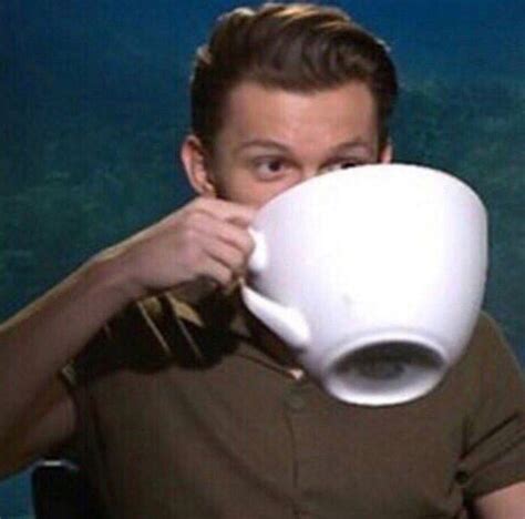 Tom Holland drinking from a giant cup of coffee, watching the drama ...