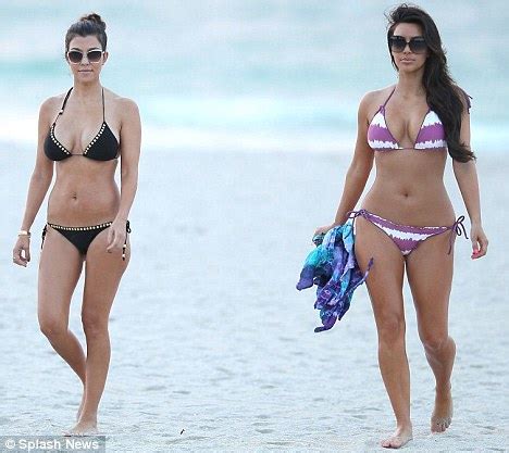 Kim Kardashian Shows Off Her Curvy Figure In Tiny Striped Bikini As She Spends Time With Sister