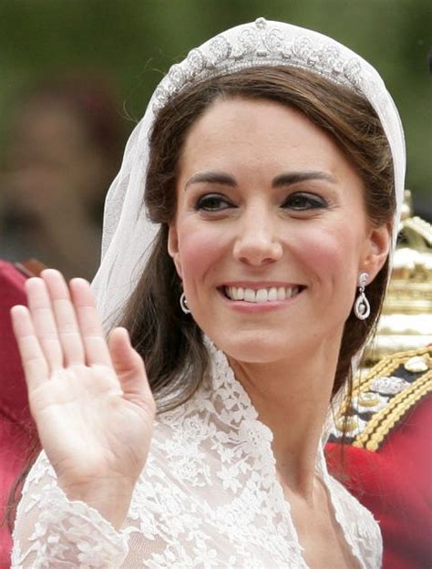 The Duke And Princess Of Cambridge Wave From Their Carriage