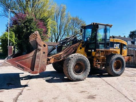 CATERPILLAR 924G 4WD LOADING SHOVEL C W FOUR IN ONE BUCKET