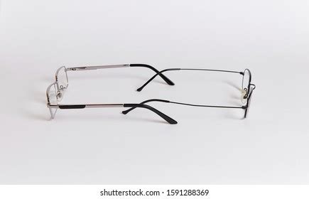 Person Wearing Two Pairs Of Reading Glasses Photos, Images & Pictures ...