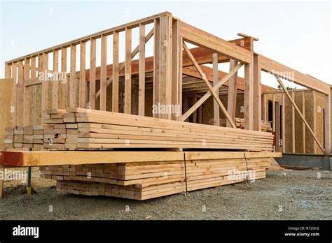 Wood Lumber by House Construction Stock Photo - Alamy