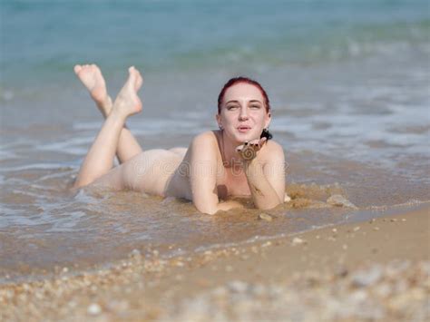 Naked Girl Lays In Line Of Surf And Sends Kiss Stock Photo Image Of