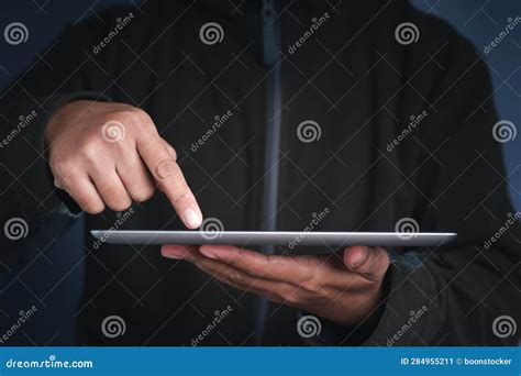 Close Up Of A Man Hand Holding A Digital Tablet And Touching On The