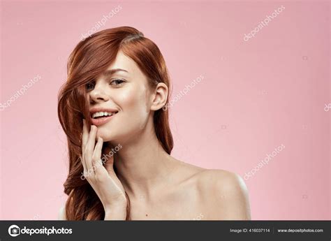 Pretty Woman With Long Beautiful Hair Grooming Hairstyle Glamor Naked Shoulders Pink Background