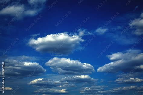 Blue sky with clouds and sun Stock Photo | Adobe Stock