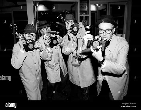 Group of pretend Paparazzi Stock Photo - Alamy