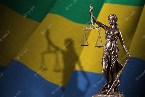 Premium Photo Gabon Flag With Statue Of Lady Justice And Judicial