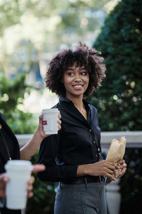 Woman with ID Card on City Street · Free Stock Photo