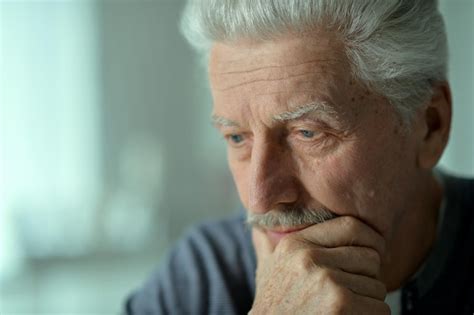 Premium Photo Close Up Portrait Of Thoughtful Senior Man At Home