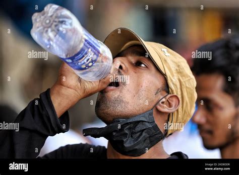 A Boy Drinks Water From A Bottle On A Hot Summer Day In Old Delhi India On April