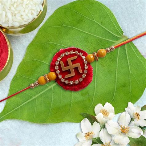 Stone Studded Swastika Rakhi Giftsmyntra