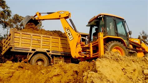 Skillfull Work Jcb Backhoe Loading Soil In Dump Truck Tata Tipper