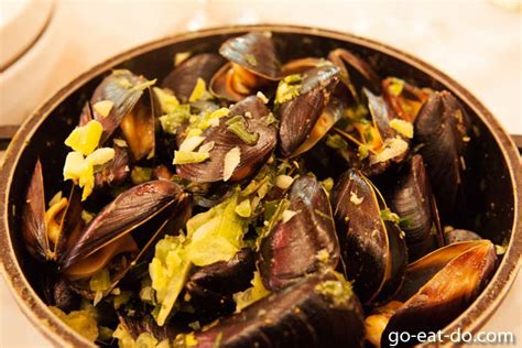 A Pot Of Steamed Mussels A Traditional Belgian Delicacy Served At The