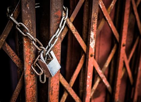 Premium Photo Close Up Of Padlock On Metal Fence