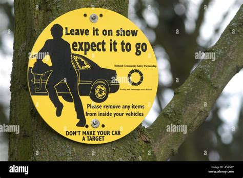 Warning Sign About Car Theft In A Car Park To Motorists In The Uk Stock