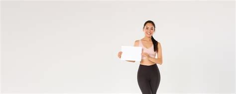 Free Photo Full Length Of Smiling Goodlooking Asian Brunette Sportswoman Female Athlete In