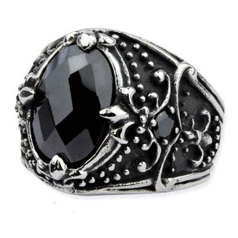 A Large Black Stone Ring With Filigrees And Leaves On The Sides Set In