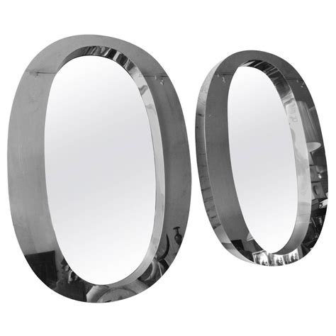 Pair Of One Of A Kind Modern Oval Stainless Steel Mirrors For Sale At