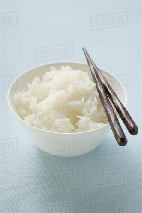 Bowl Of Rice With Chopsticks Stock Photo Dissolve