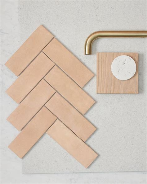 Some Wood Tiles And A Faucet On A Table