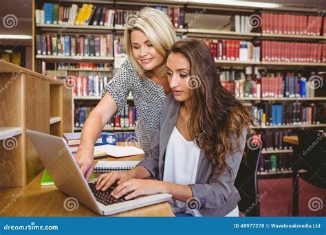 Blond Mature Student Helping Her Classmate Stock Photo Image Of School Revising