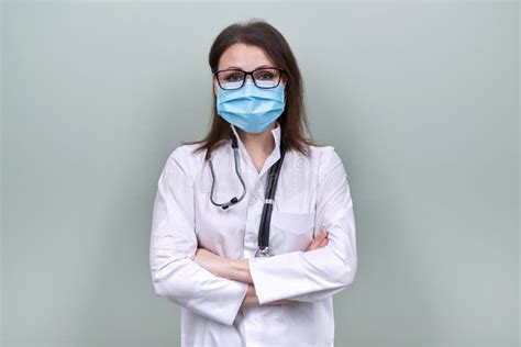 Portrait Of Doctor Woman In Medical Protective Mask With Stethoscope