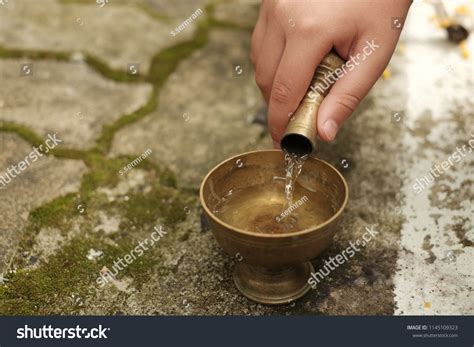 Buddhists Grail Pouring Water Into Container Stock Photo 1145109323