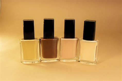 Premium Photo Nude Colors Nail Polish Bottles Close Up Nude Background