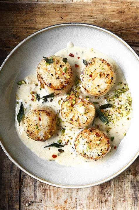 Scallops In Creamy White Wine Sauce Serving Dumplings