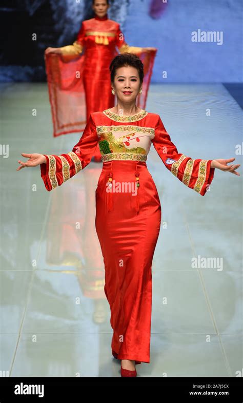 Elder models wearing traditional Chinese outfit designed by Chen Fumei ...