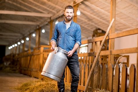 Premium Photo Portrait Of A Handsome Farmer Standing With Retro Milk