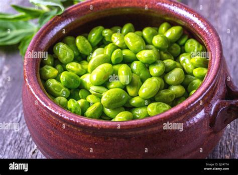 Bowl Of Edamame Soybeans On Wooden Background Stock Photo Alamy