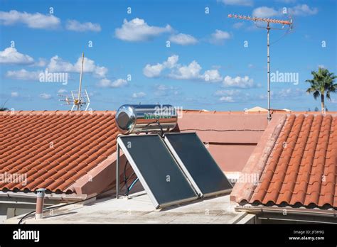 Solar Panels And Hot Water Cylinder On Roof Of Apartment Building Rethymno Rethymnon
