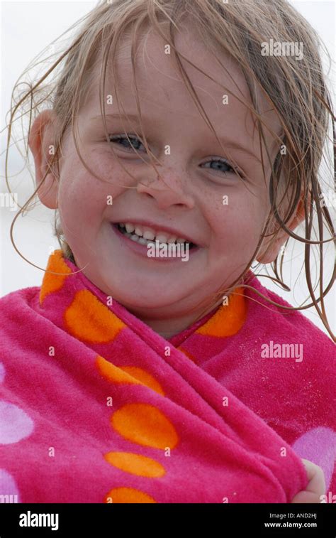 Portrait Of A Little Girl Wrapped In A Beach Towel Stock Photo Alamy