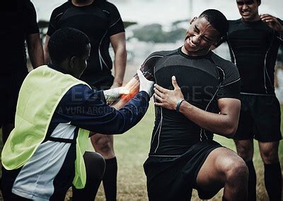 Men Rugby And Shoulder Injury On Sports Field With Glowing Red And Ai