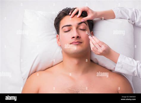 Handsome Man In Spa Massage Concept Stock Photo Alamy